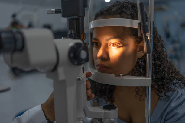 istock Woman performing vision exam 1493302510