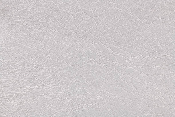 istock White artificial or synthetic leather background with neat texture and copy space, colorful fabric sample with leather-like finish aimed for upholstery, fashion, sewing or footwear projects 1493303961