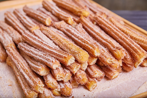 Image of Baked good cinnamon sugar star shaped churros Mexican baked pastry