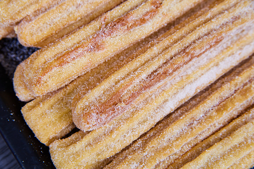 Image of Churros Mexican pastry bakery sweet treats coated in cinnamon sugar and star-shaped baked good