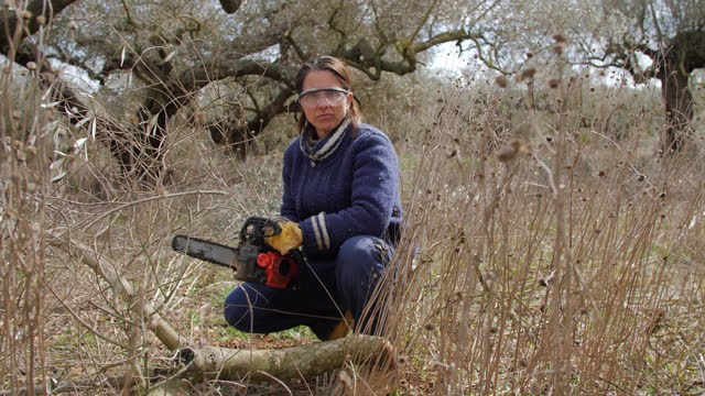 Empowered Woman with a Chainsaw
