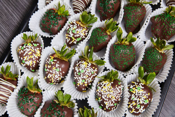 istock Saint St. Patricks Day themed chocolate-covered strawberries green edible glitter white sprinkles 1493310449