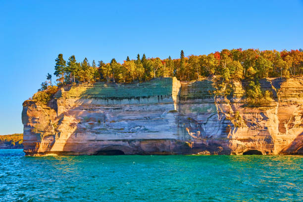 istock Submerged caverns at pictured rocks national park lake view with summer and fall trees 1493311050