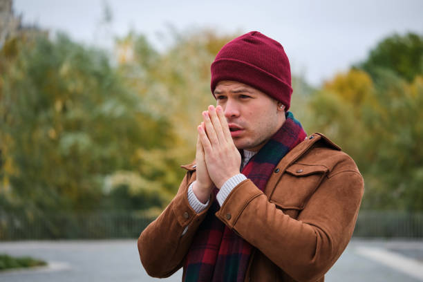istock Latin young man rubbing his hands to get some warmth during winter. 1493311761