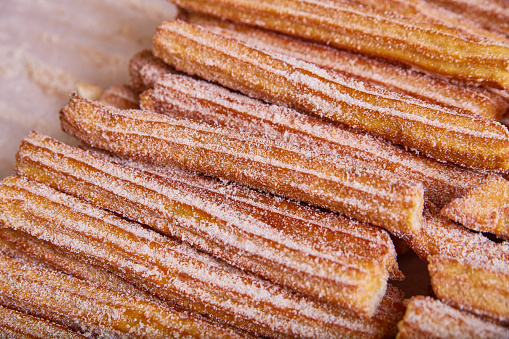 Image of Wall of churros a star-shaped Mexican baked pastry coated in cinnamon sugar