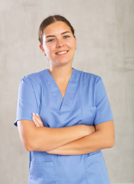 istock Young woman posing in medical uniform in studio 1493314789