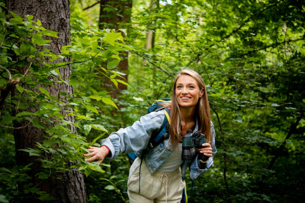 istock Woman is enjoying her vacation in nature 1493315336