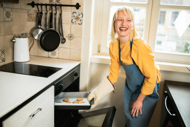 istock Happy girl baking her favorite cookies 1493324405
