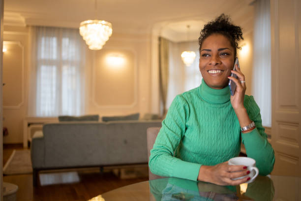 istock Happy young woman using phone 1493325077