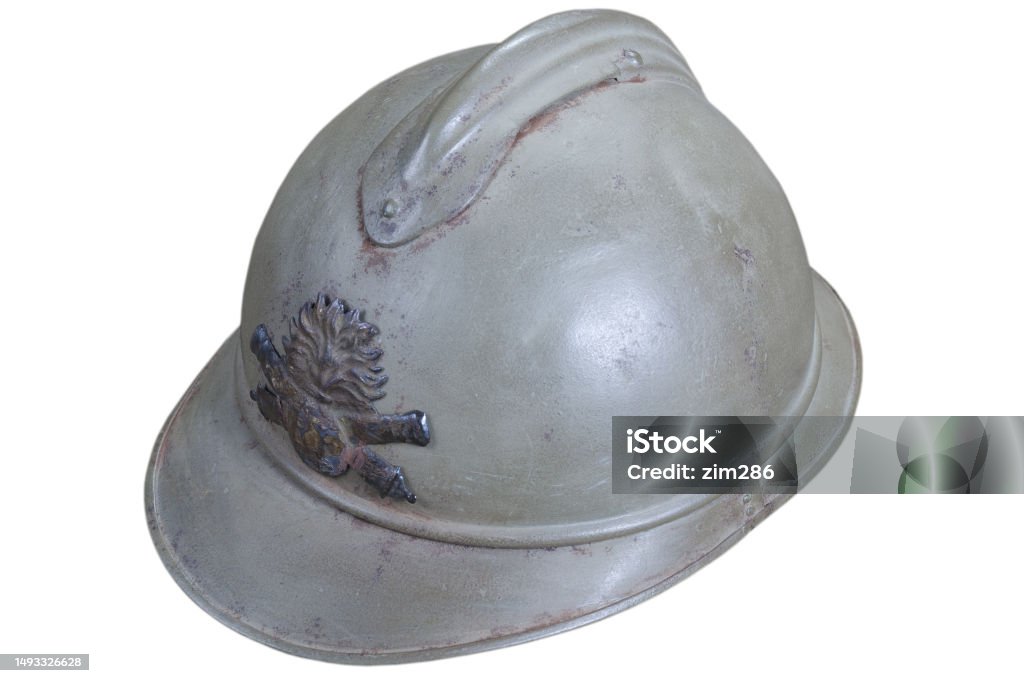 The Adrian helmet, a combat helmet originally produced for the French Army during World War I. Its original version, the M15, was the first standard helmet of the French Army. The Adrian helmet, a combat helmet originally produced for the French Army during World War I. Its original version, the M15, was the first standard helmet of the French Army. Isolated on white background. 1918 Stock Photo
