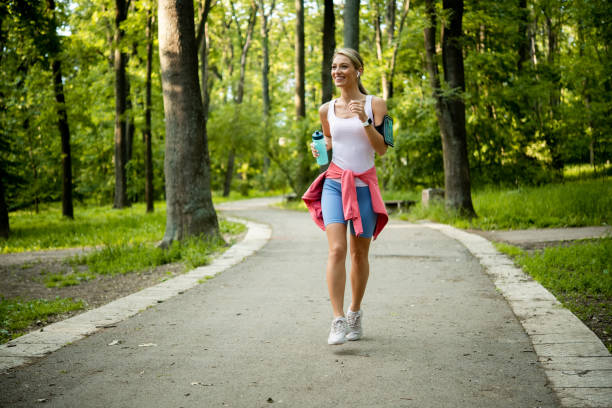 istock Young woman jogging at the park 1493326992