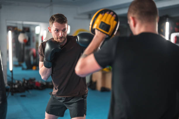 istock Caucasian Male Practicing New Boxing Sequences In A Gym 1493329677
