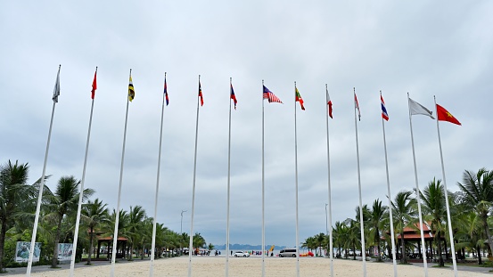 Ha Long,Quang Ninh Province,Asia,Vietnam.\nXunzhou Island is at Ha Long Bay. This is the only earth island in Ha Long Bay. Karst caves, sandy beaches, seascapes and characteristic buildings make up the unique scenery of the island. This is a good place for Vietnamese people to have leisure and entertainment holidays.\nwaving flags over the island.