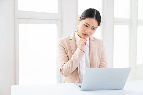 istock young asian businesswoman using laptop,think 1493330931