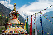 Beautiful Tibetan Buddhism stupa in Chhomrong village with Mt.Annapurna south in the background.