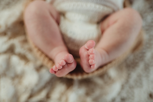Tiny feet and toes of a newborn baby