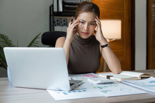 istock Tired stressed business woman suffering from headaches while working from home office 1493355716