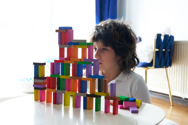 istock Cute Little Boy Playing with wooden block 1493355870