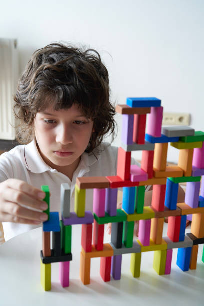 istock Cute Little Boy Playing with wooden block 1493355929