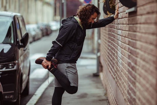istock Young man stretching before exercising in the city 1493357096