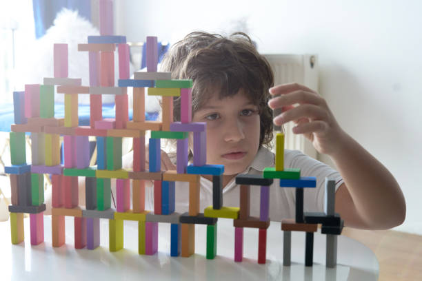 istock Cute Little Boy Playing with wooden block 1493357622