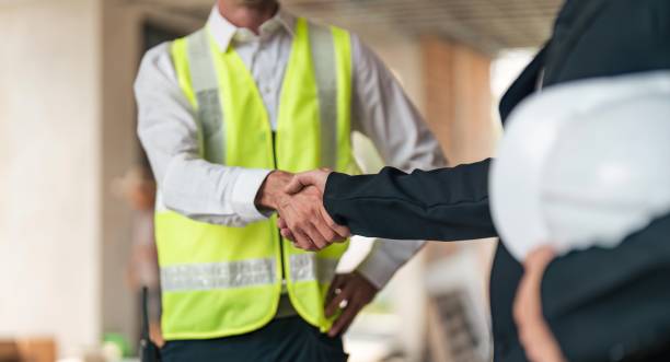 istock Happy young civil engineer manager and architects handshaking at construction site and looking to next construction phase , cooperation teamwork concept 1493364999