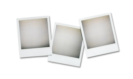 three blank polaroid pictures overhead isolated on white with clipping path