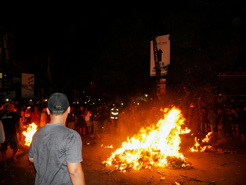 Perang Obor - Torchlight Battle Tegal Sambi, JEPARA , INDONESIA JUNE 20 : Villagers take part in tochlight batle at Tegalsambil, vilage on june 20 2022 in, Jepara Indonesia.