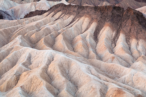 Zabriskie Point located in Death Valley National Park is a popular location for view the spectacular and unique erosional landscape.