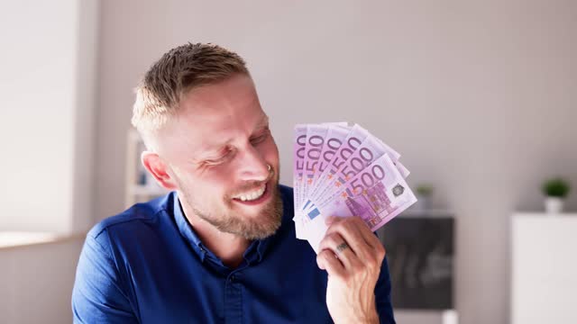 Man Holding Euro Paper Money