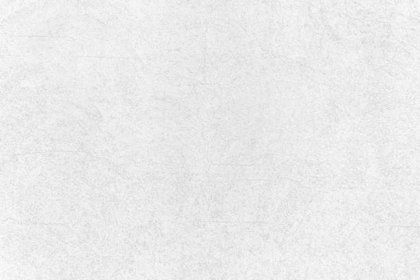 istock White concrete wall texture background. Rough and grunge concrete texture. 1493380404