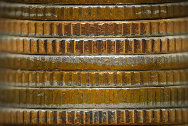 Pile of bronze coins, side view. Macro close up