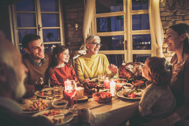 istock Cheerful multi-generation family talking during dinner at home. 1493385549