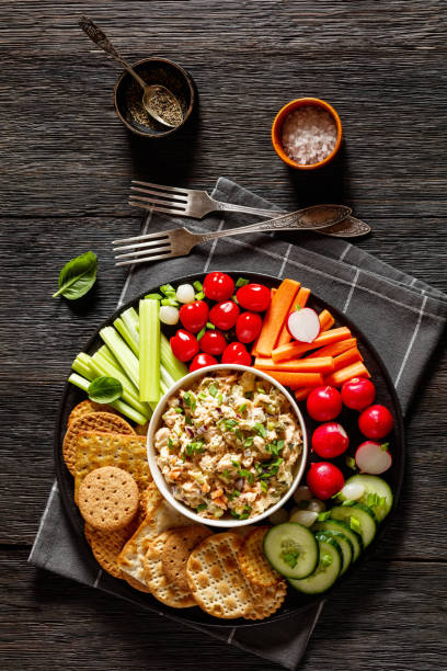 istock salmon salad with fresh veggies and crackers 1493388360