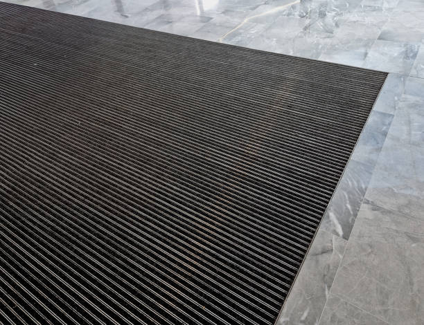 istock mat with felt filling and cassette brushes, gray aluminium. profiles embedded below the pavement level. replaceable felt brushes clean the shoes and soak up the water. the risk of slipping is reduced 1493389587