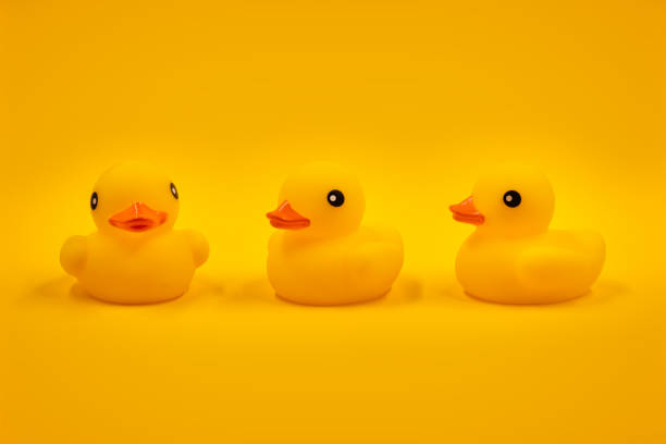 istock Yellow rubber ducks and one in a row 1493392768