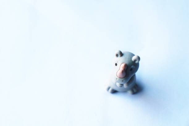 Rhino shape rubber doll toy on white background