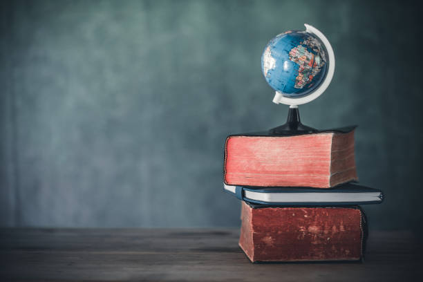 istock Books with globe on the school desk. education concept. 1493393609