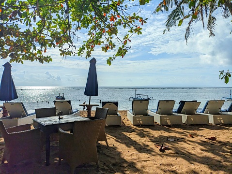 morning atmosphere of sanur beach with sea view and white sand