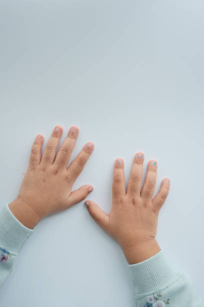 istock close up of little child hands on white 1493394436