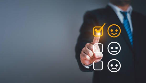 istock Businessman giving customer service satisfaction rating with happy smile emotion expression face icon. Customer satisfaction survey and product evaluation rating concept 1493398374