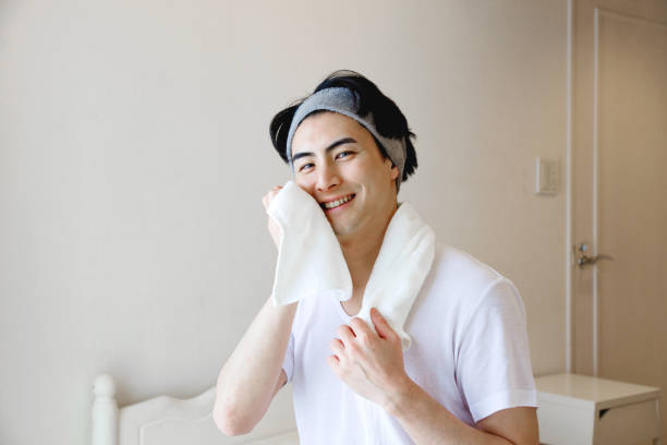 istock Japanese man using a towel to wipe his face 1493399058