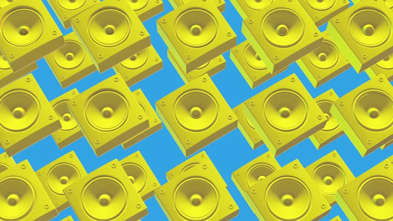 Beautiful colored yellow speaker on a cold blue background.