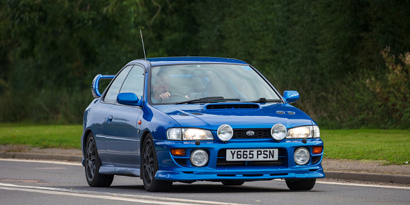 Bicester, Oxon, UK, October 10th 2021.  2001 blue SUBARU IMPREZA   classic car travelling on an English country road