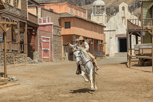 Gran Canaria - April 2023: city of Sioux presents an immersive cowboy experience where tourists can observe a bank heist and the sheriff's pursuit of the bandits in a realistic western setting