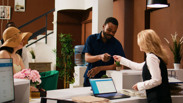 istock Diverse couple checking in at hotel 1493403144