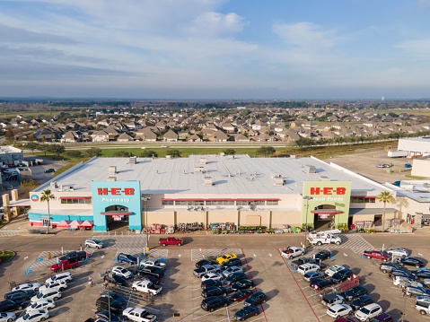 League City, United States – December 22, 2022: An aerial view of H-E-B Grocery Store in League City, Texas with cars parked in parking lot