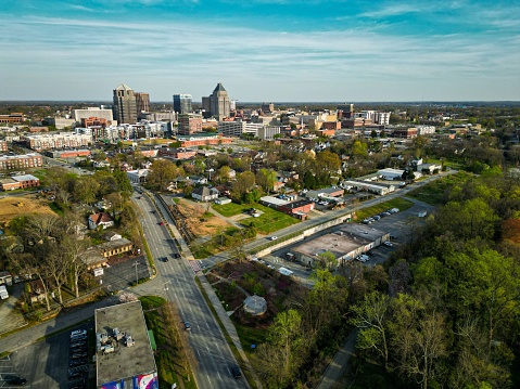 An aerial view of modern buildings on a sunny day in Greensboro, NC