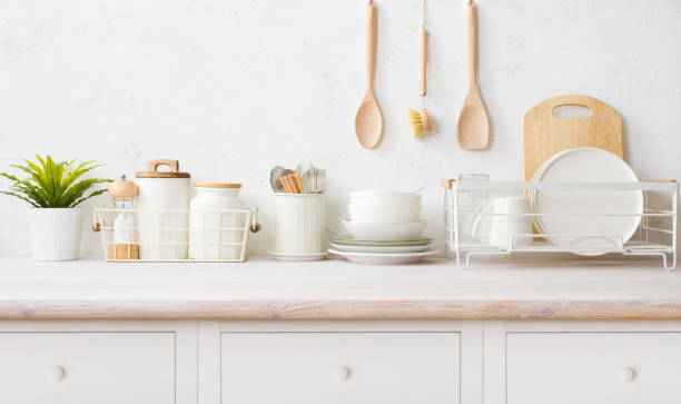 istock Various kitchen utensils on wooden table countertop with vintage drawers 1493404902