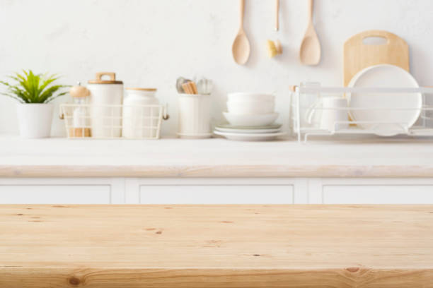 istock Empty wooden table top on blurred kitchen room counter background 1493404905
